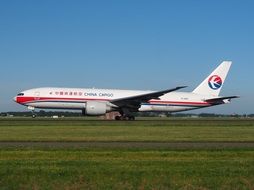 Boeing 777 on green grass