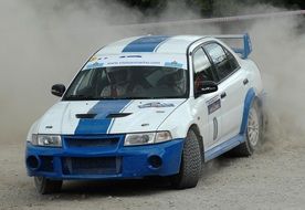 white single race car in rally