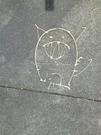 cartoon drawing on asphalt