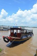 shed motor boat on mekong river, vietnam, saigon