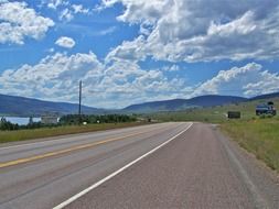 Wide road against the backdrop of the scenic landscape in Montana