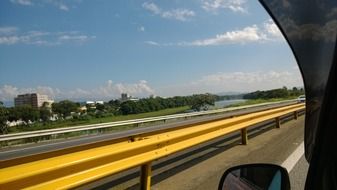 View from car window to road