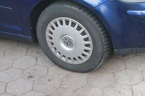 wheel of a blue car close-up