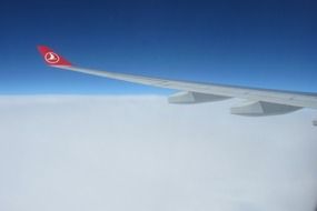 aircraft wing over the cloud