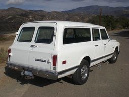 white chevrolet on the road