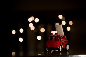 toy fire engine on christmas lights background