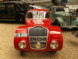 red car in a museum