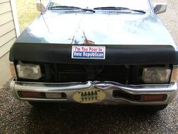 sign on the car i am too poor to vote republican