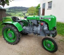 green tractor without roof