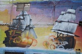 beautiful graffiti on the wall, drawings of ships on the wall