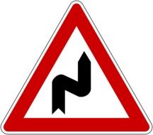 double curve warning road sign