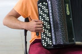 man playing an accordion