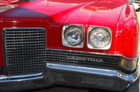 front bumper of a vintage red car
