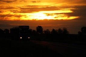 truck in the background of a fiery sunset in Paraguay, South America