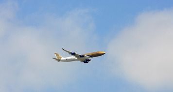 gold aircraft plane