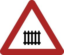 warning road sign about a railway crossing