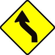 yellow sign with black arrow