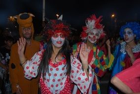 street artists in carnival costumes and masks