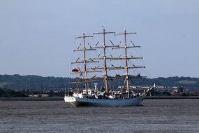 distant view of a large sailing ship on the water