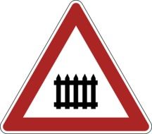 road sign warns about a railway crossing