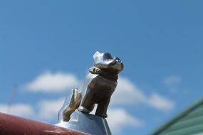 figurine as a car mascot