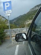 car with broken mirror in parking