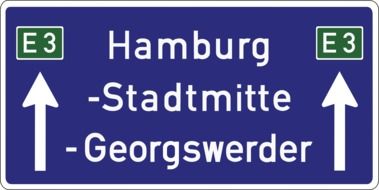 road sign with the names of cities