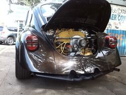 VW Beetle car with open hood