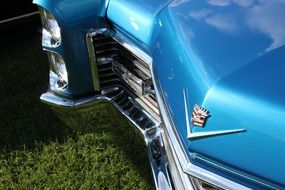 front view of a blue shiny classic auto close-up