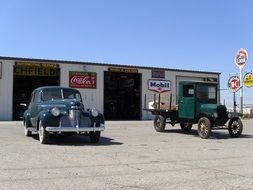 vintage cars at service station, usa