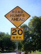 road humps ahead, traffic sign in countryside at summer