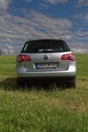 silver Volkswagen on green grass