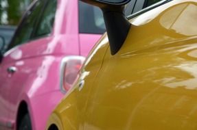 pink and yellow mini coopers closeup