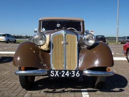 vintage car with a license plate in the street
