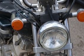 headlight of a old motorcycle close-up