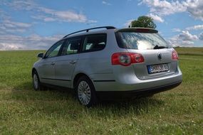 Volkswagen stands on green grass