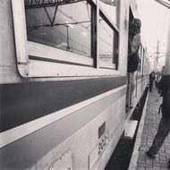 black and white photo of a train at the station