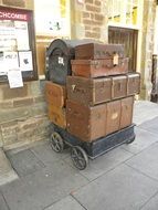 many vintage suitcases at the station