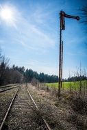 railroad tracks under the sun