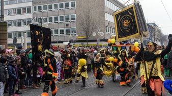 people in carnival costumes on the street