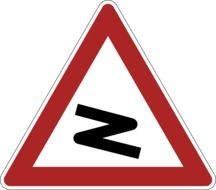 road sign with a bend of the road