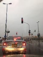 car on the road during the rain