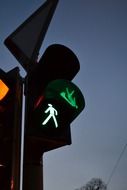 green sign of pedestrian traffic light