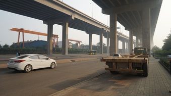 vehicles under the bridge