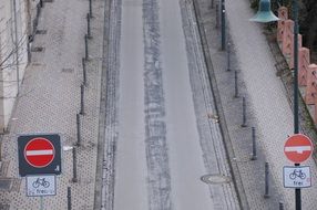 gray road with traffic signs