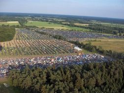 colorful festival parking at countryside, aerial view