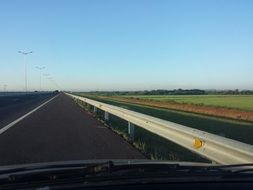 view of the road from the windshield of the car