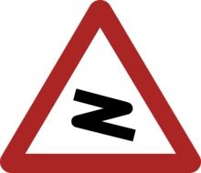 road bend warning sign