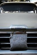 water bag on vintage car grill