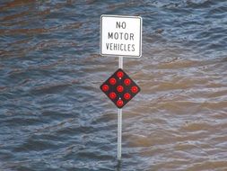 traffic sign in water during a flood